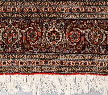 A carpet, Tabriz, part silk, 40-50 Radj, ca 300 x 195 cm.