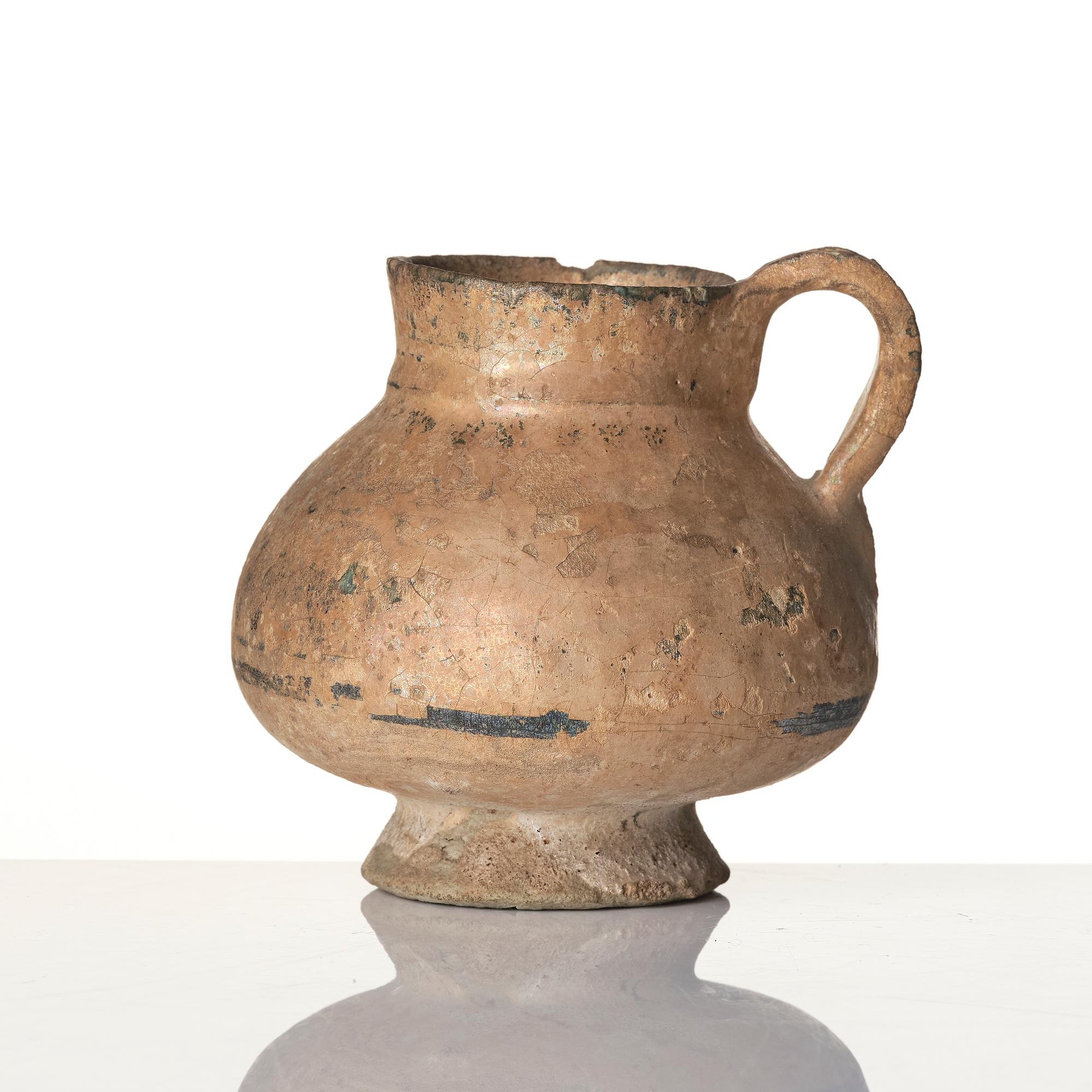 A central Asian pottery jug 12th-13th century.