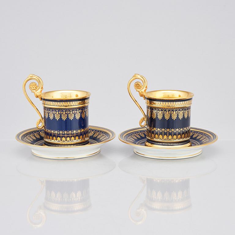 A pair of Sèvres cups with stands, 19th Century.