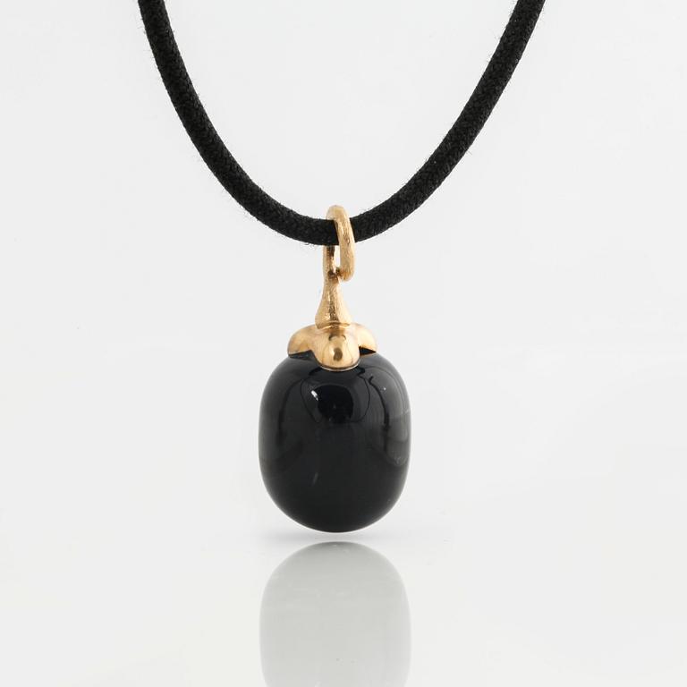 A onyx pendant by Ole Lynggaard.