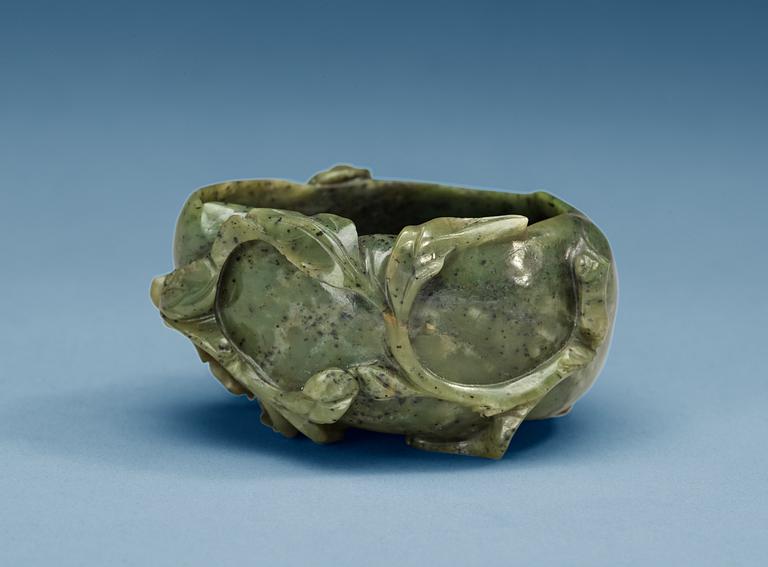 A carved nephrite brush washer, Qing dynasty.