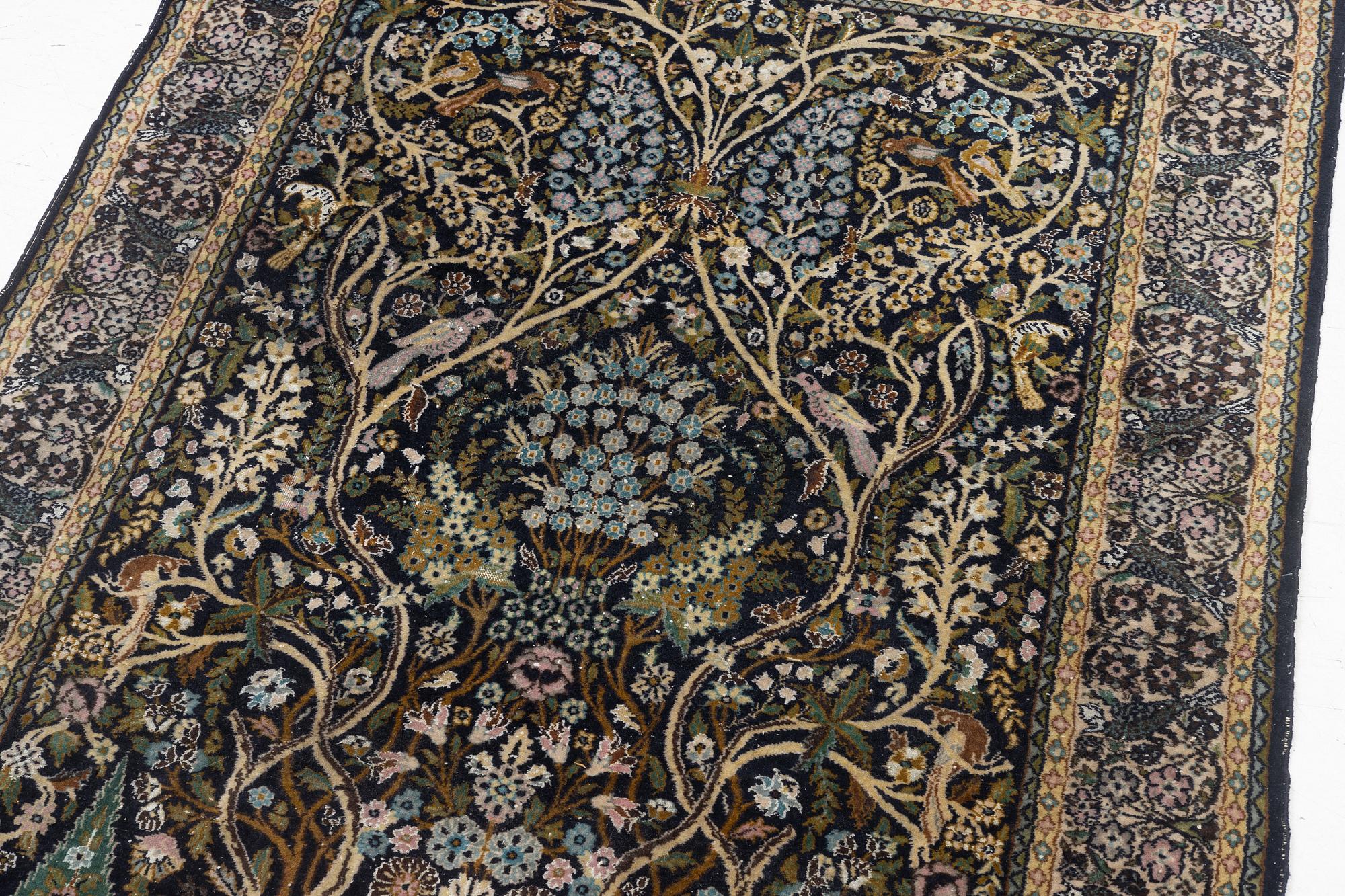 A figural Quum carpet, c. 179 x 125 cm.