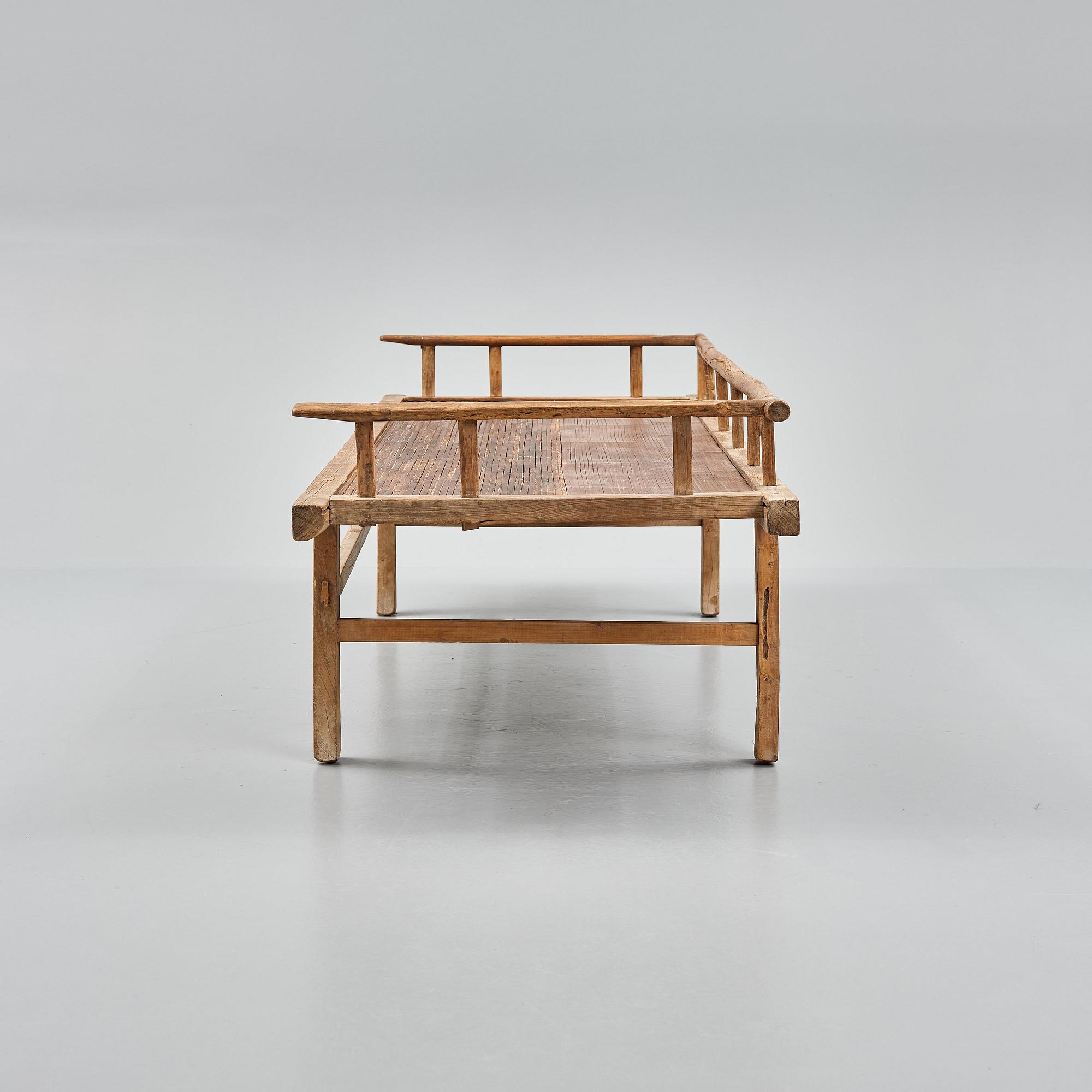 A wooden daybed, South East Asia.