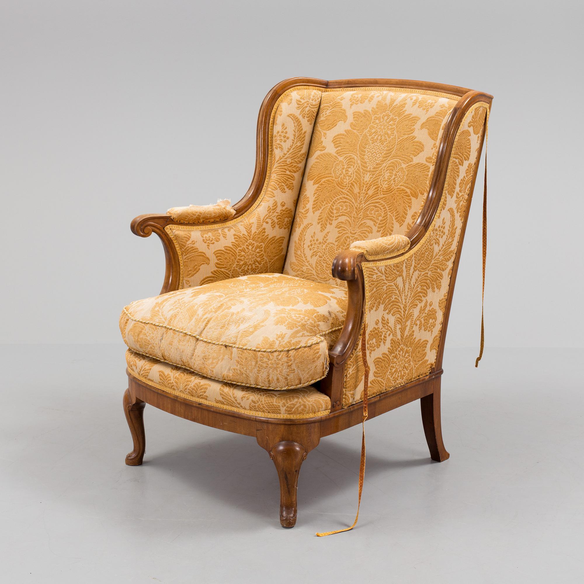 A Rococo style wing chair, first half of teh 20th Century.