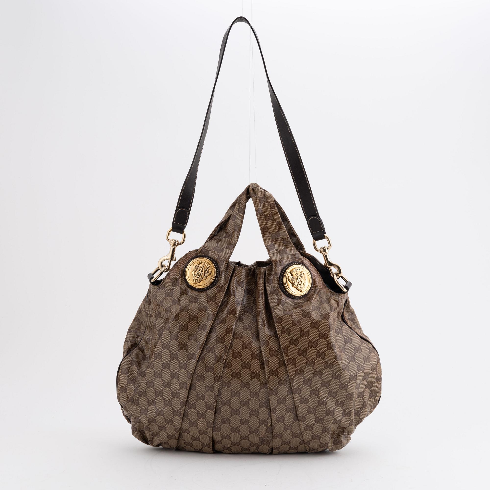 Gucci, a canvas handbag.