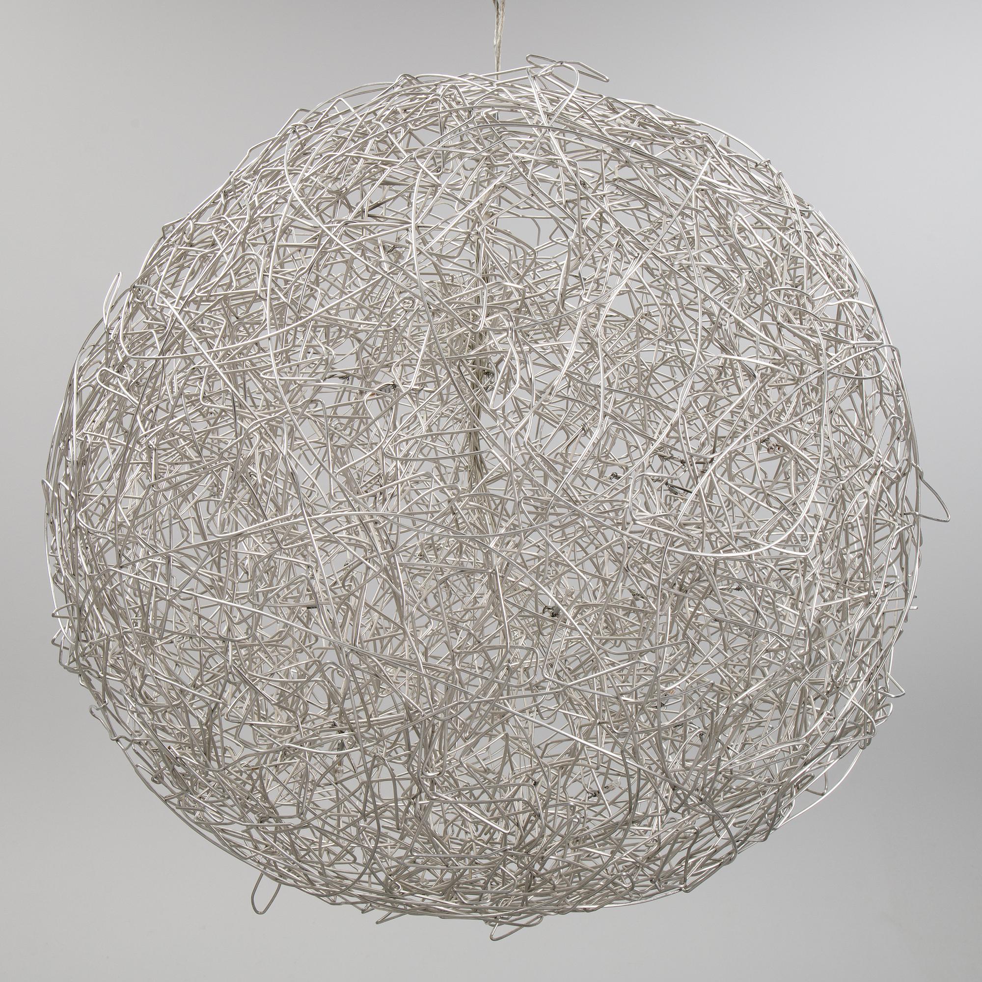 A 'Fil de Fer Ovale' ceiling light by Enzo Cattelini.