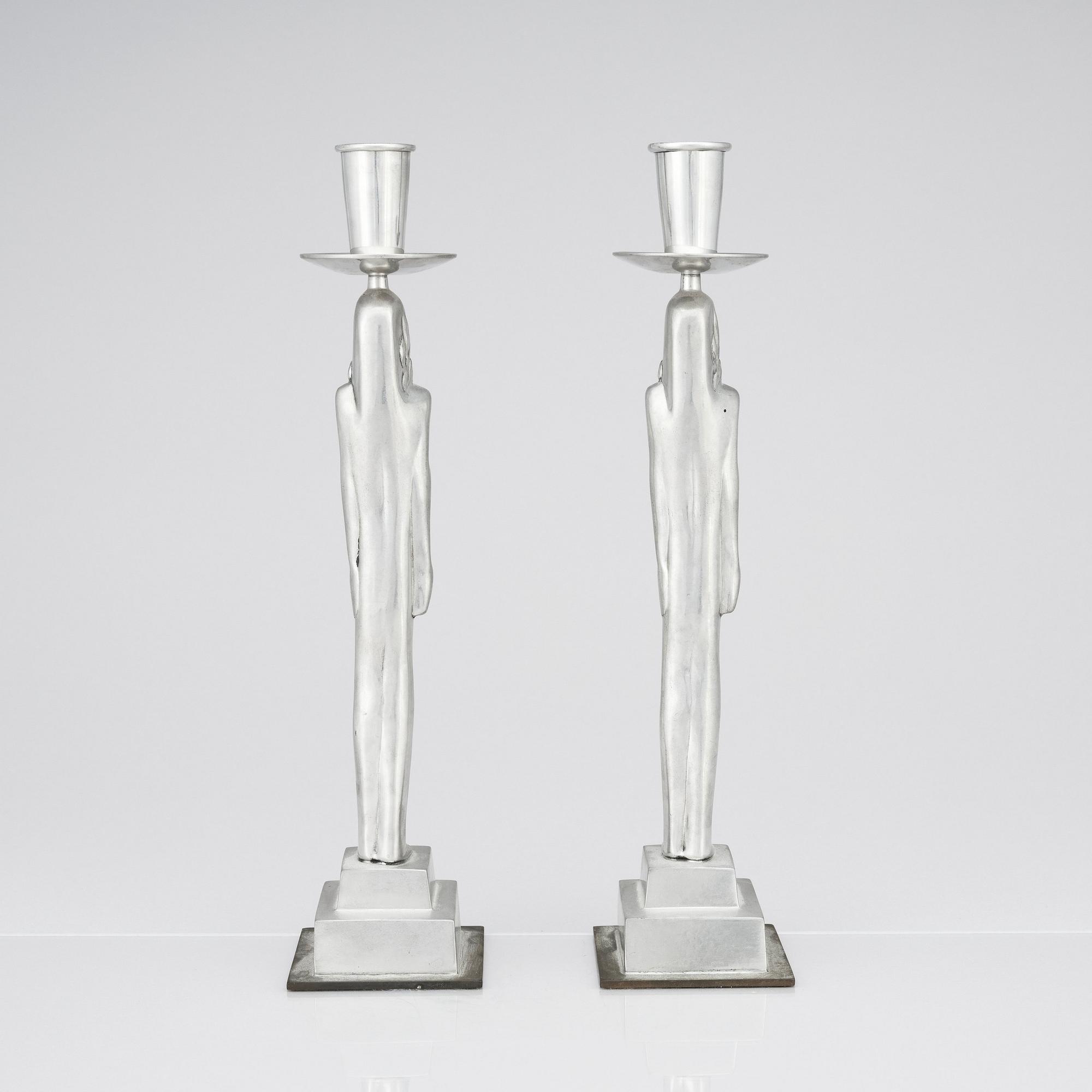 Edvin Öhrström, a pair of pewter and brass 'Egyptian' candlesticks, Svenskt Tenn, Sweden 1984.