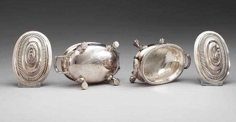 A pair of English 19th century silver sauce tureens, makers mark of Thomas Robins, London 1813-1814.