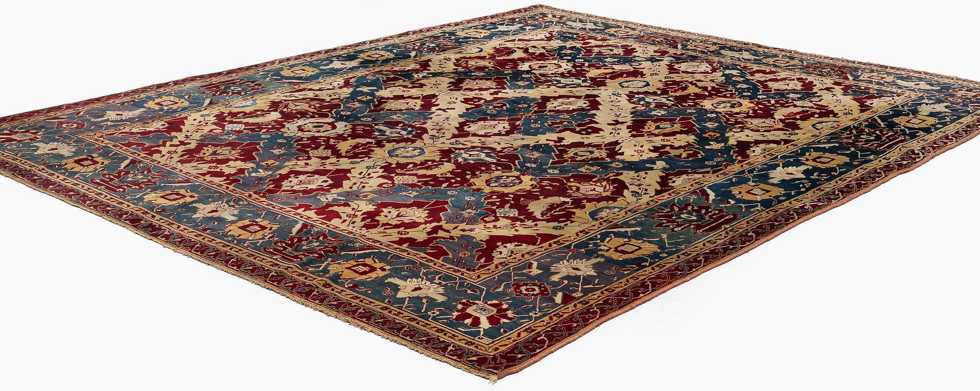 An Antique Agra carpet of 'Dragon Lattice' design, North India, 375 x 298 cm.