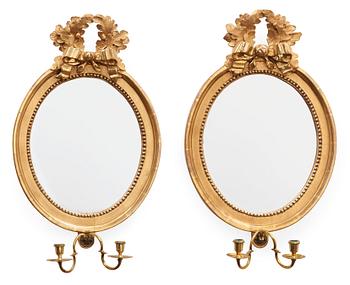 Two matched Gustavian two-light girandole mirrors by J. Åkerblad.