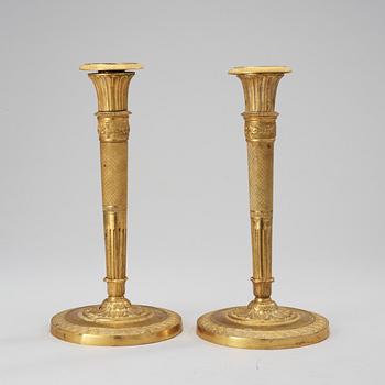 A pair of French Empire early 19th century candlesticks.