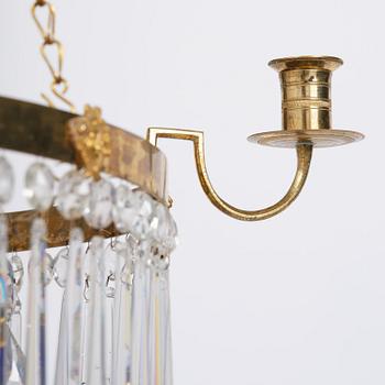 A late Gustavian five-light gilt brass and cut glass chandelier, Stockholm, late 18th century.