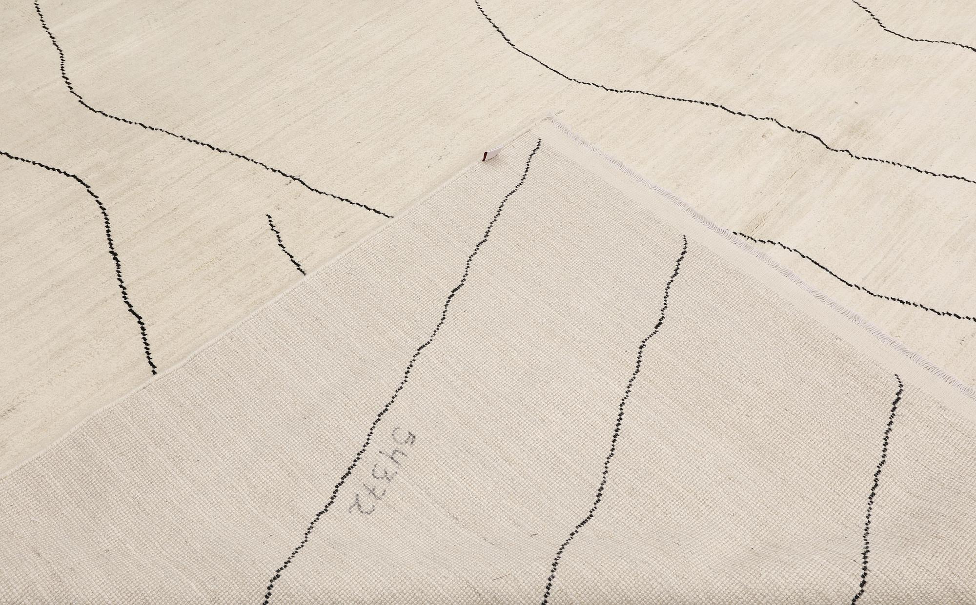 A Moroccan carpet, 335 x 258 cm.