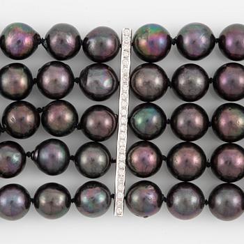 Necklace, five-row with cultured black pearls, 18K gold and white gold with brilliant-cut diamonds.