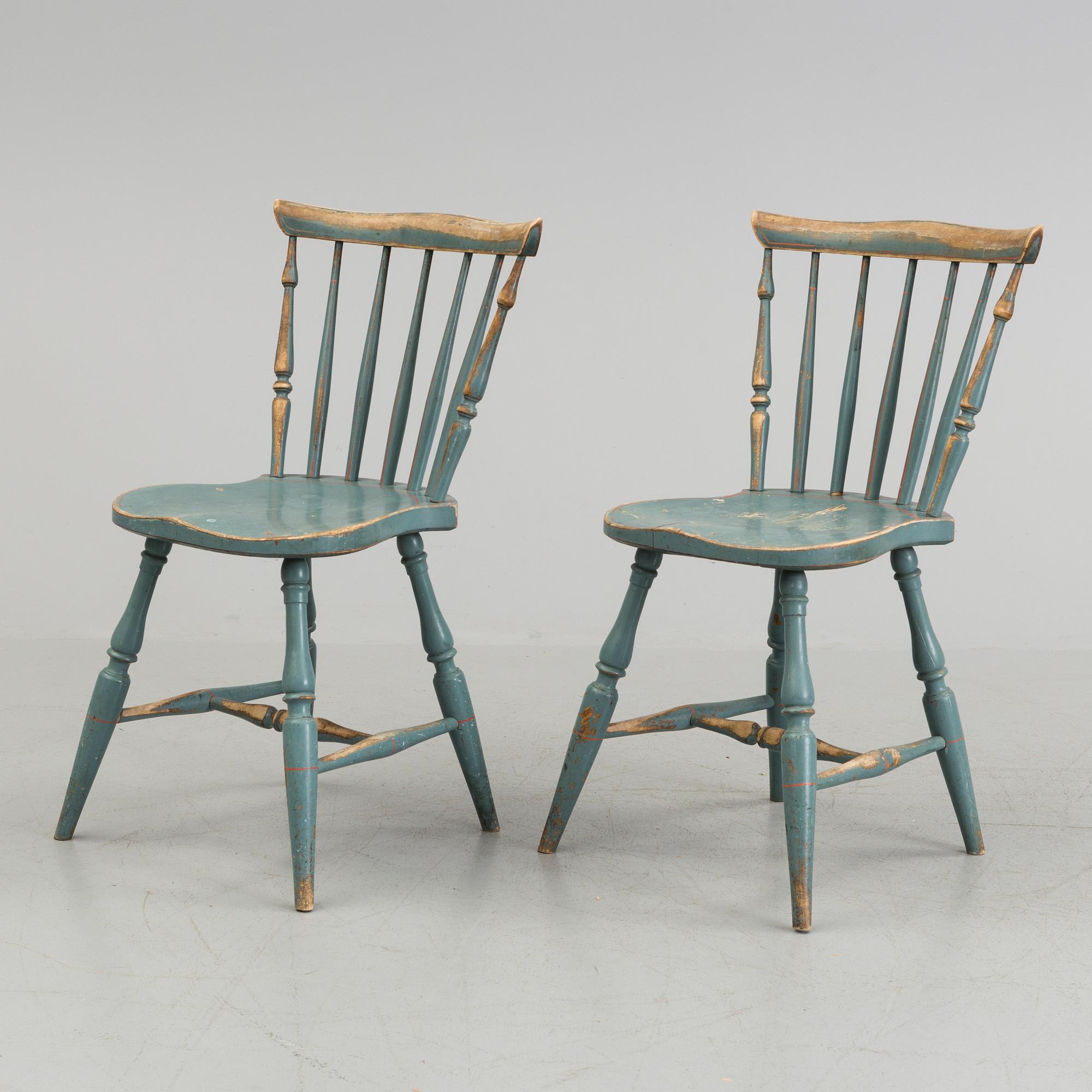 A pair of late 19th century painted chairs.