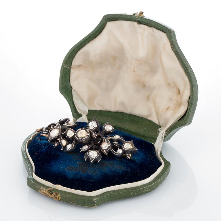 A brooch set with rose-cut  diamonds.