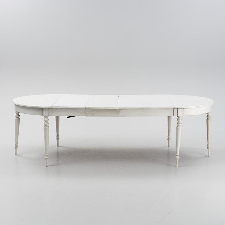 A painted dining table, 20th Century with older parts.