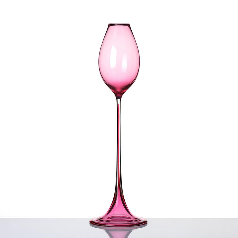 Nils Landberg, a cerise tinted glass goblet, Orrefors Sweden 1957.