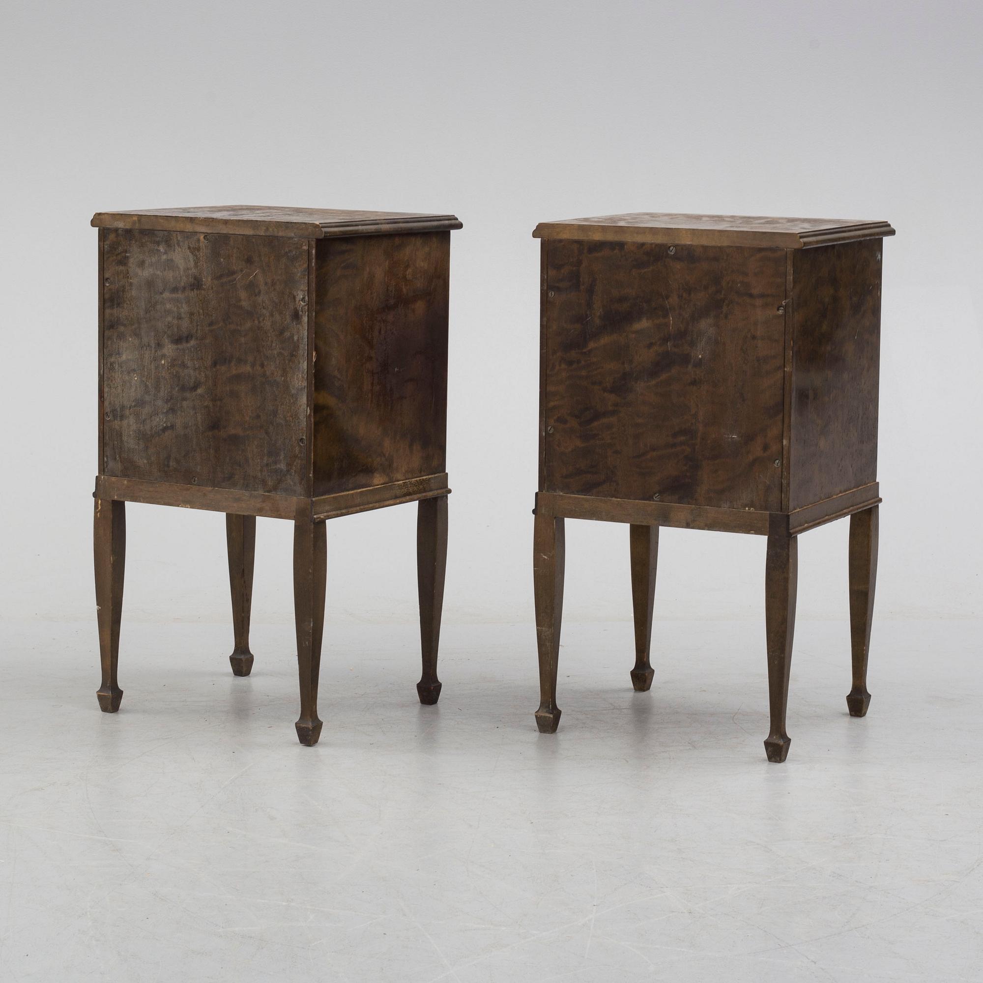a pair of Art Déco bedside tables.