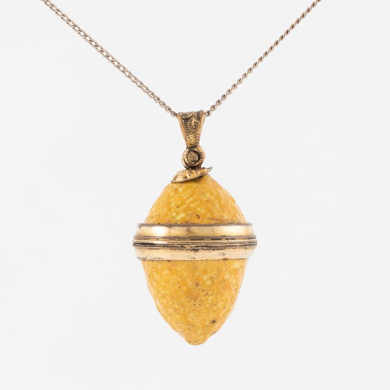 Charm in the form of a lemon with yellow enamel.
