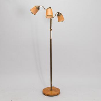 A brass floor lamp, mid-20th century.