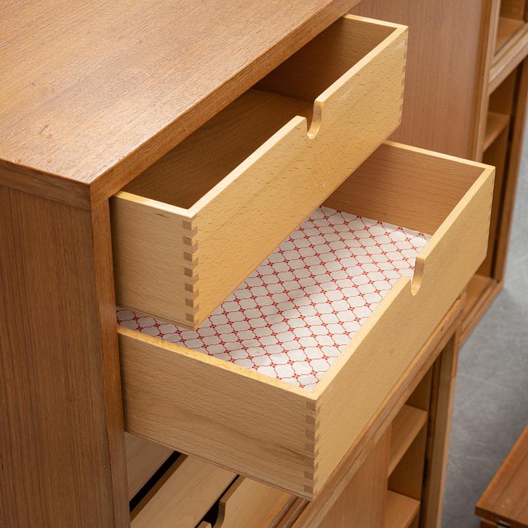 A 'String' teak veneered shelving system by Nils Strinning.