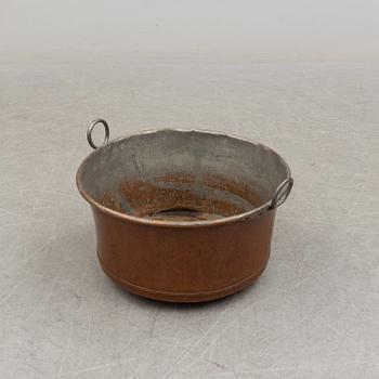 A 19th century copper cauldron.