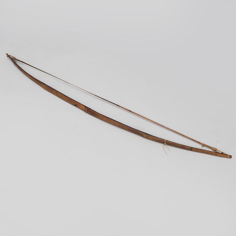 A 19th/20th century south-east asian bow with an arrow.