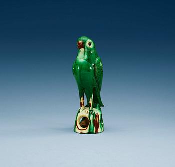 A green glazed figure of a falcon, Qing dynasty.