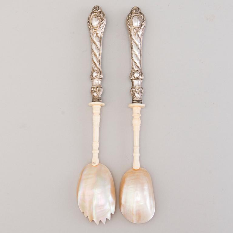 A pair of 19th Century salad servers in silver, mother of pearl and bone. In original wooden box.