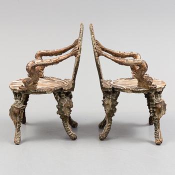 A pair of 20th century grotto armchairs.