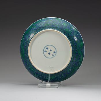 A large green enamelled blue and white dragon dish, Qing dynasty with Kangxi's six character mark.