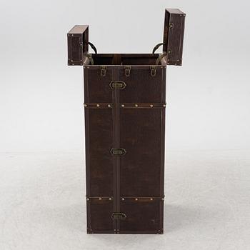 A leather suitcase-shaped bar cabinet.