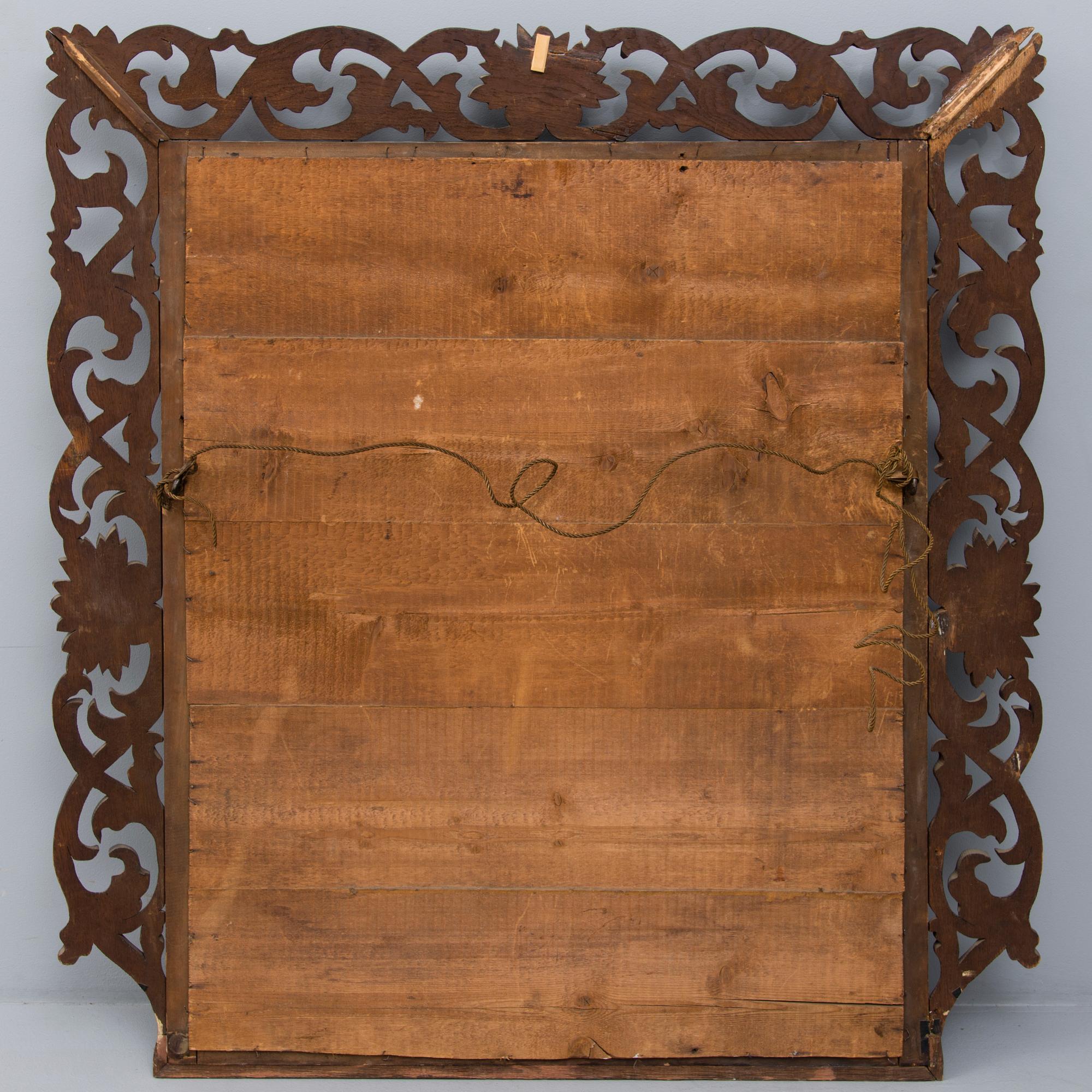 A BAROQUE MIRROR, late 19th century.