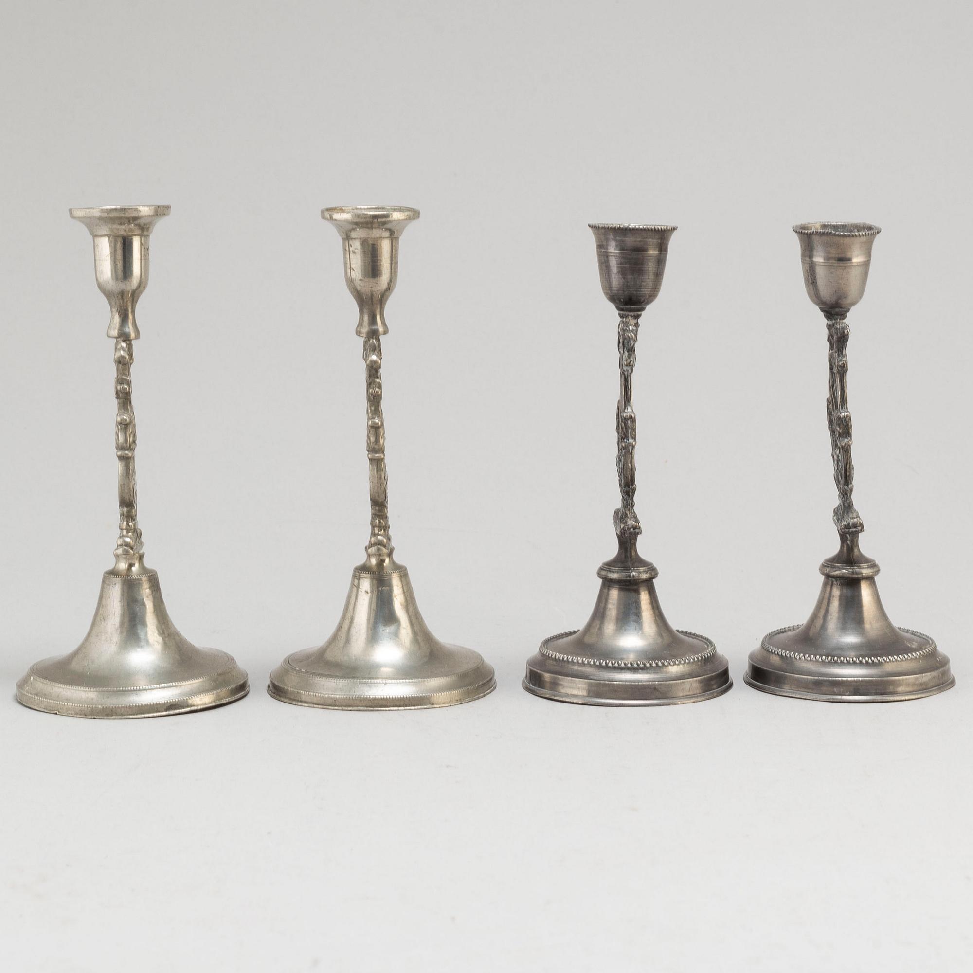 Two pair of Swedish pewter candlesticks, early 19th century and ca 1900.