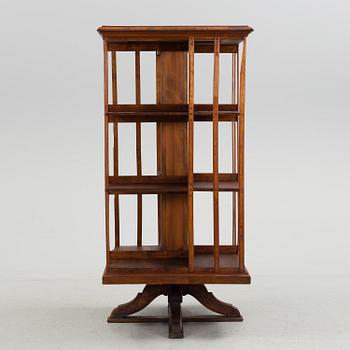 An early 20th century turning book shelf.