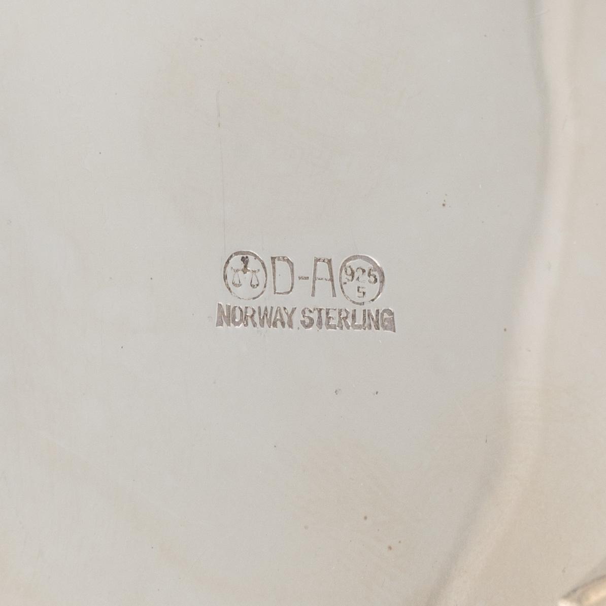 A Norwegian Silver Coffee Pot, Creamer and Sugar Bowl, mark of David Andersen, Oslo, mid-20th Century.