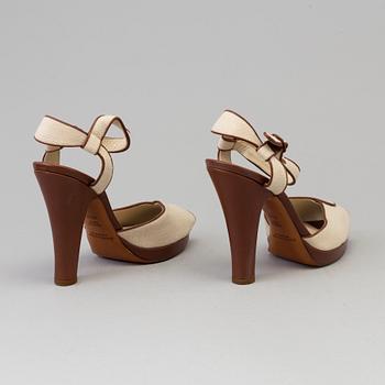 High heeled sandals by Ralph Lauren.