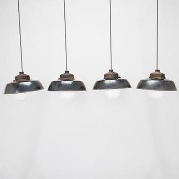 Paavo Tynell, four 1930s pendant lights / industrial lights for Taito.