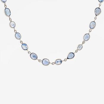 An 18K white gold necklace set  with faceted sapphires.