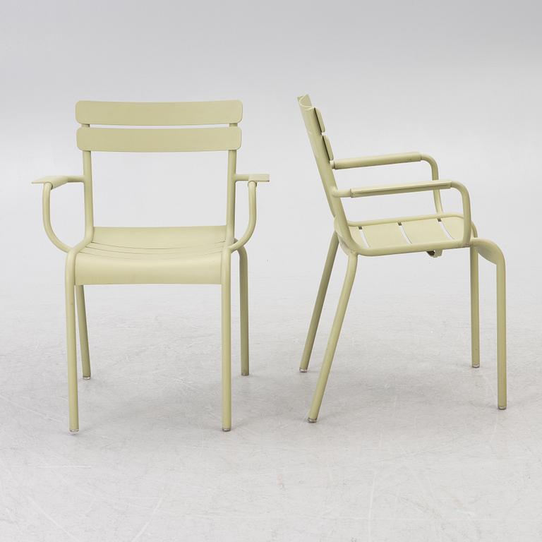 Frédéric Sofia, a table and two chairs for outdoor use, "Luxembourg" Fermob, France, 21st century.