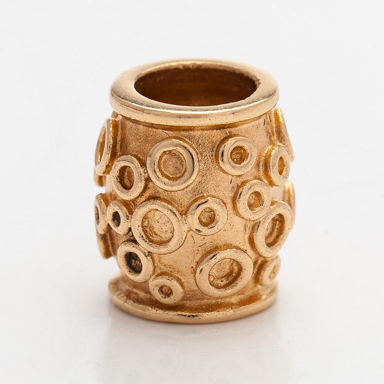 Kalevala Koru, riipus, viistehiottu turmaliini, 14 karaatin kultaa, 2003.