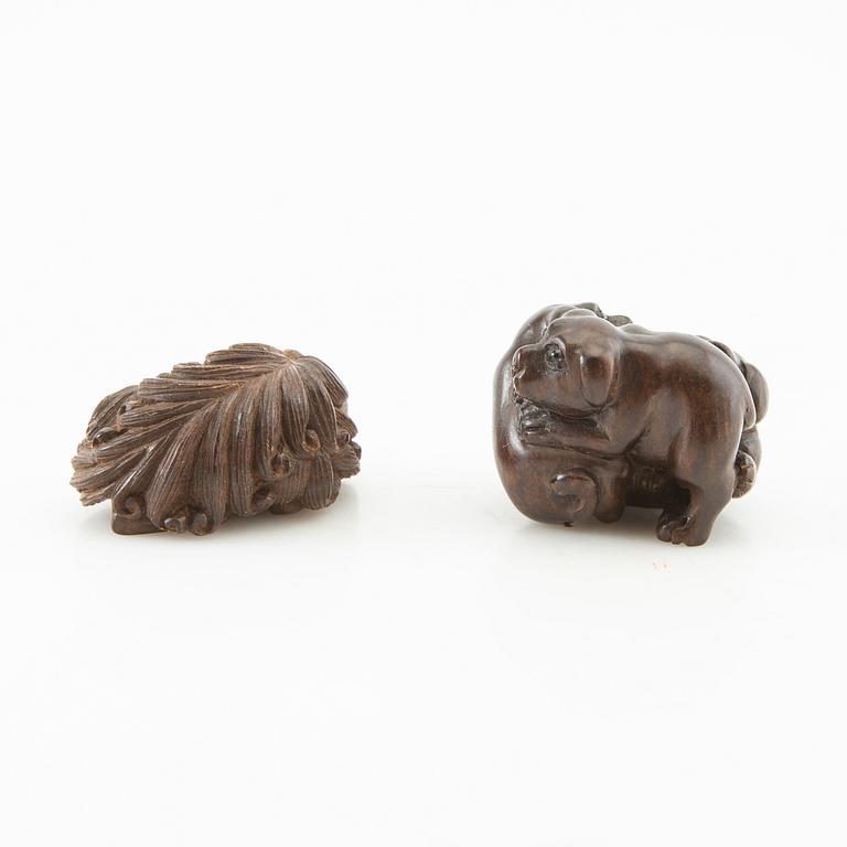 Netsuke, two pieces, hardwood. Japan, 20th century.