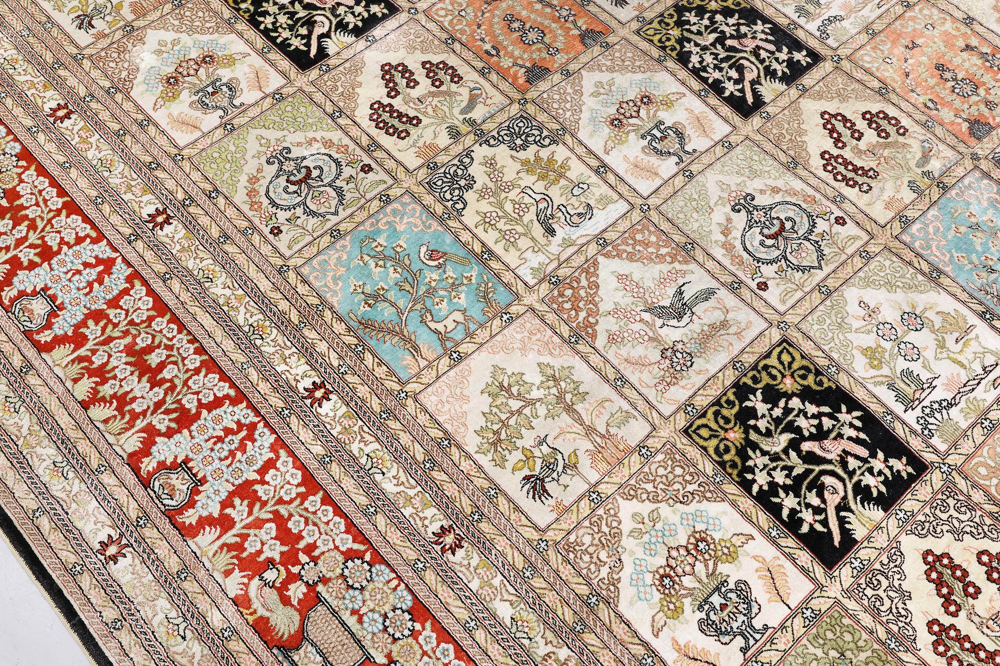 An oriental silk carpet, approx. 376 x 274 cm.