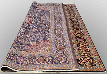 A carpet, Kashmar, signed, ca 390 x 295 cm.