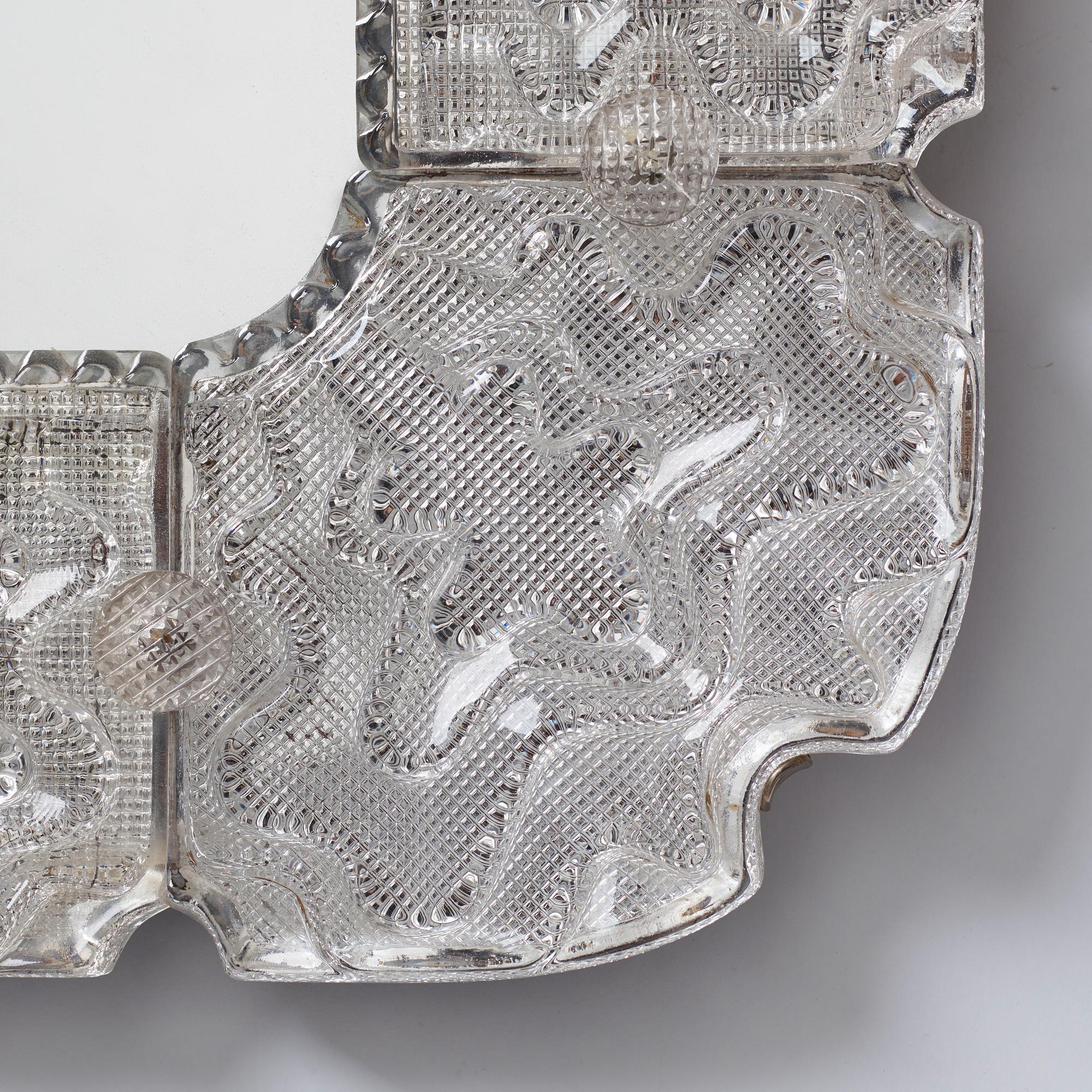 Carl Fagerlund, a Swedish Modern cast glass framed mirror, Orrefors ca 1940-50's.