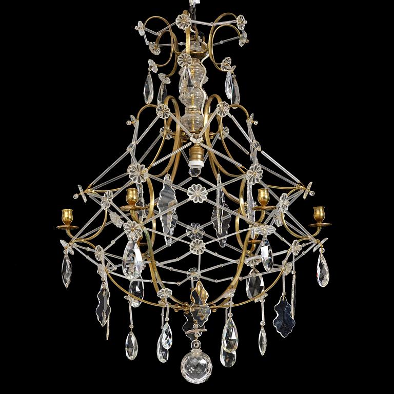 A seven-light gilt brass and cut glass rococo chandelier, mid 18th century.