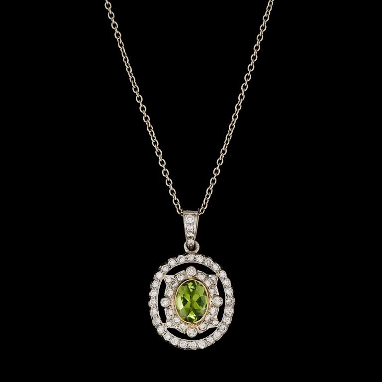 HÄNGSMYCKE, fasettslipad peridot med briljantslipade diamanter, tot. ca 1 ct.