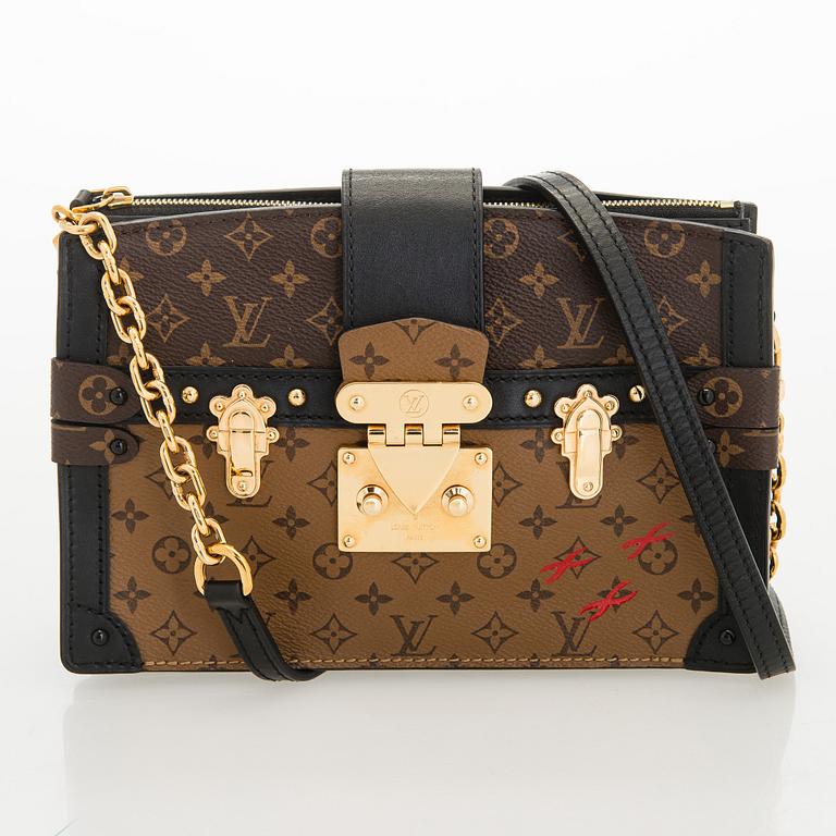 Louis Vuitton, a "Reverse Monogram Trunk Clutch" bag.
