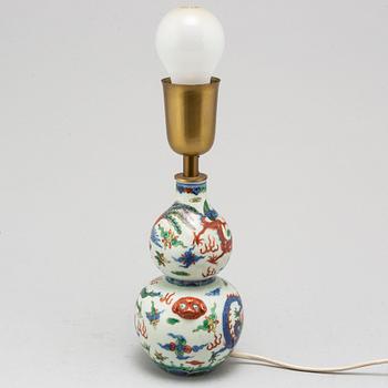 A Chinese porcelain wucai double gourd vase, turned into a table lamp, 20th century.